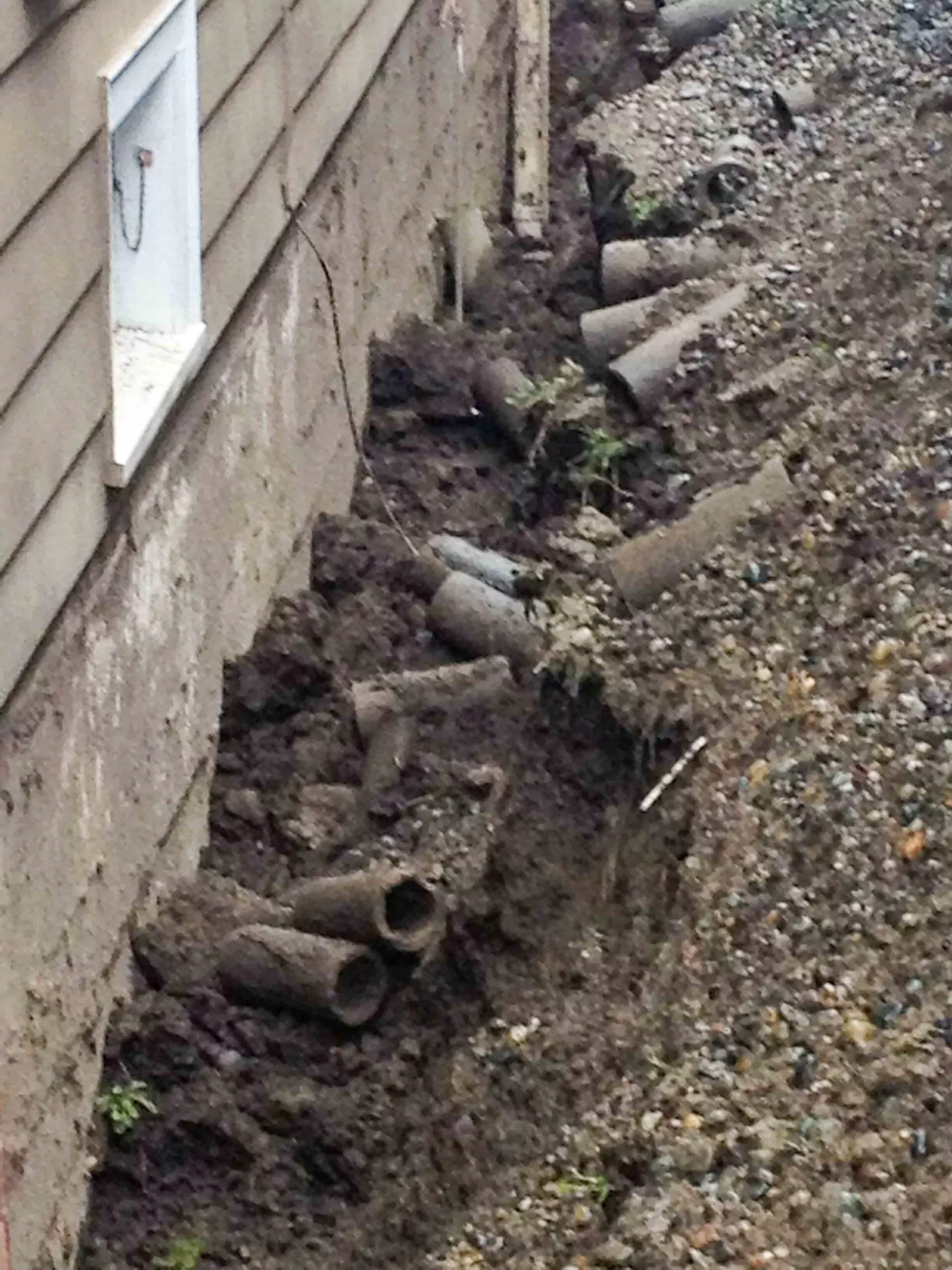 Removal Of Existing Broken Footing Drain Pipes 